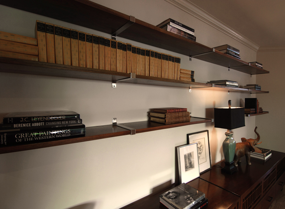 Floating shelves were custom stained to match the wood credenzas below.