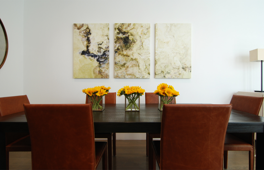 Leather chairs and an ebonized wood table in the dining room.