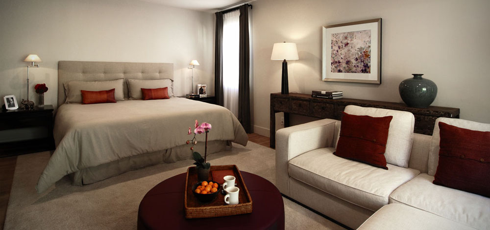 Master bedroom with linen comforter and draperies.
