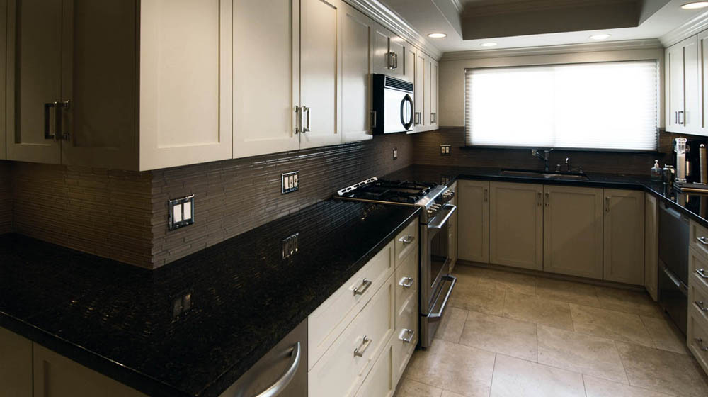 A small kitchen remodel. Notice the interlace of the tile on the outside corner. The tile setter wanted to kill me. It was worth it.